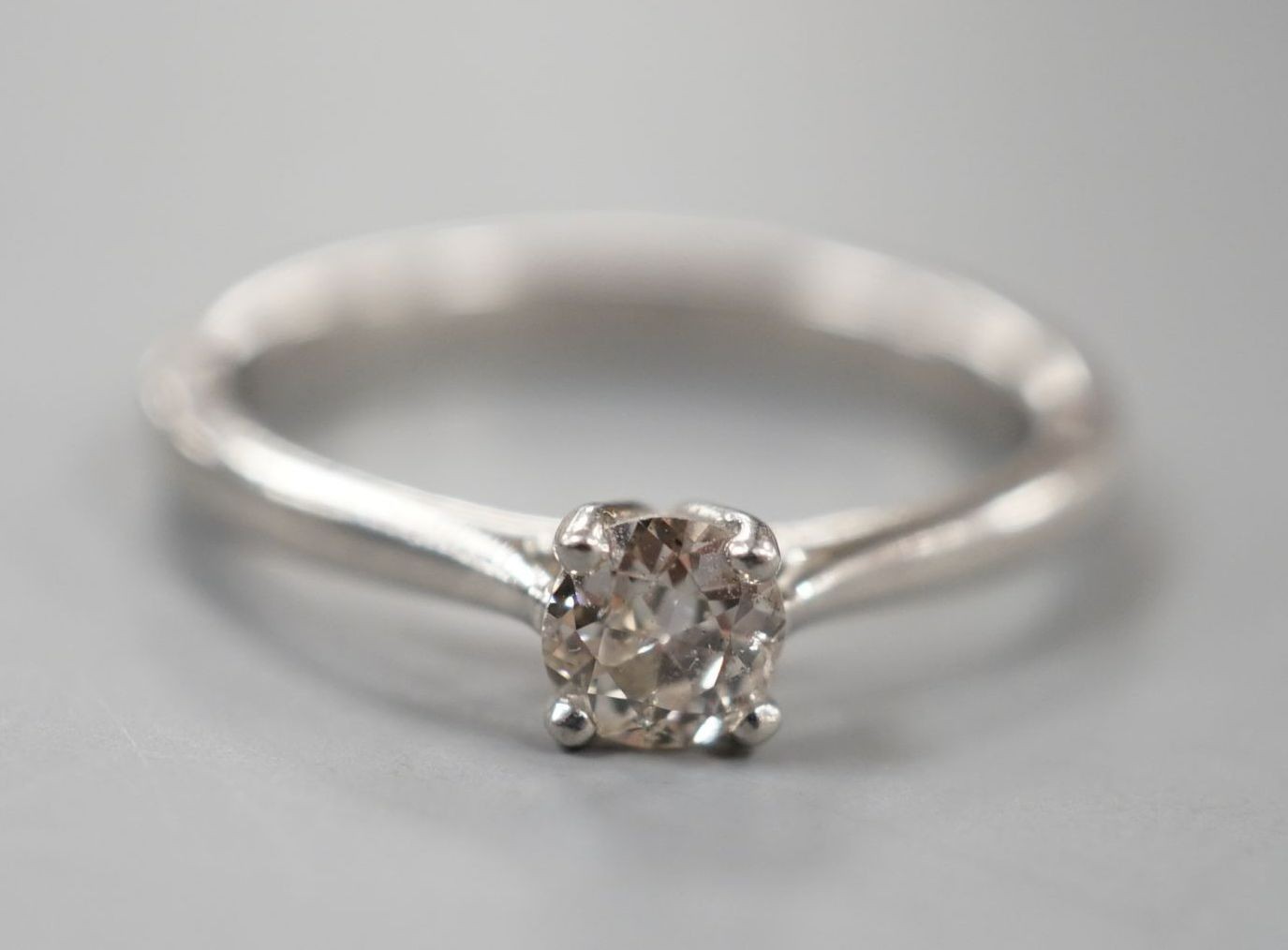 A modern platinum and solitaire diamond ring, size Q/R, gross weight 5.4 grams